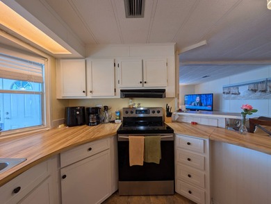 Modern Quality - Peace of Mind! Welcome to this 2 bedroom, 2 on Grasslands Golf and Country Club in Florida - for sale on GolfHomes.com, golf home, golf lot