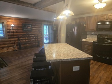 Gorgeous Log Cabin in highly desired location.  Deeded Access to on Northern Bay Golf Resort and Marina in Wisconsin - for sale on GolfHomes.com, golf home, golf lot