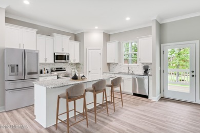 Welcome to your coastal haven, nestled among ancient oaks along on Lockwood Folly Country Club in North Carolina - for sale on GolfHomes.com, golf home, golf lot