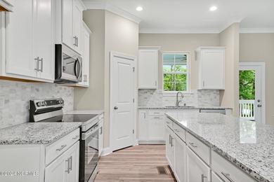 Welcome to your coastal haven, nestled among ancient oaks along on Lockwood Folly Country Club in North Carolina - for sale on GolfHomes.com, golf home, golf lot