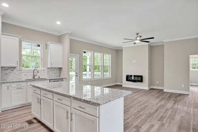 Welcome to your coastal haven, nestled among ancient oaks along on Lockwood Folly Country Club in North Carolina - for sale on GolfHomes.com, golf home, golf lot