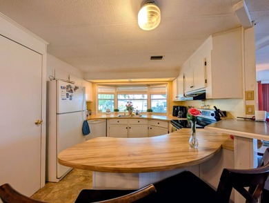 Modern Quality - Peace of Mind! Welcome to this 2 bedroom, 2 on Grasslands Golf and Country Club in Florida - for sale on GolfHomes.com, golf home, golf lot