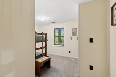 Charming Lakefront Cabin in Hideaway Hills Resort awaits you! on Hide-A-Way Hills Golf Club in Ohio - for sale on GolfHomes.com, golf home, golf lot