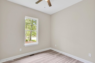 Welcome to your coastal haven, nestled among ancient oaks along on Lockwood Folly Country Club in North Carolina - for sale on GolfHomes.com, golf home, golf lot