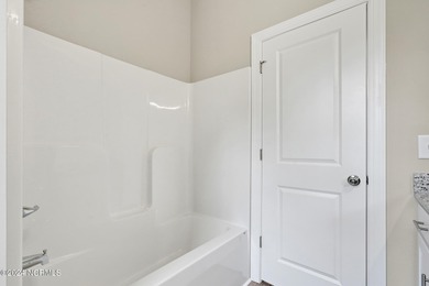 Welcome to your coastal haven, nestled among ancient oaks along on Lockwood Folly Country Club in North Carolina - for sale on GolfHomes.com, golf home, golf lot