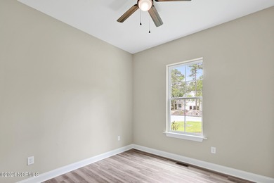 Welcome to your coastal haven, nestled among ancient oaks along on Lockwood Folly Country Club in North Carolina - for sale on GolfHomes.com, golf home, golf lot