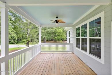 Welcome to your coastal haven, nestled among ancient oaks along on Lockwood Folly Country Club in North Carolina - for sale on GolfHomes.com, golf home, golf lot