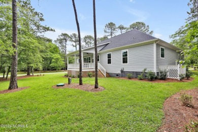 Welcome to your coastal haven, nestled among ancient oaks along on Lockwood Folly Country Club in North Carolina - for sale on GolfHomes.com, golf home, golf lot