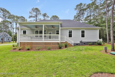 Welcome to your coastal haven, nestled among ancient oaks along on Lockwood Folly Country Club in North Carolina - for sale on GolfHomes.com, golf home, golf lot