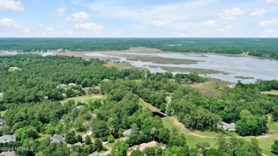 Welcome to your coastal haven, nestled among ancient oaks along on Lockwood Folly Country Club in North Carolina - for sale on GolfHomes.com, golf home, golf lot