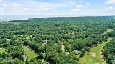 Welcome to your coastal haven, nestled among ancient oaks along on Lockwood Folly Country Club in North Carolina - for sale on GolfHomes.com, golf home, golf lot