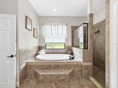 Lovely Meditterrean home welcomes you through rustic double on The Club at Eaglebrooke in Florida - for sale on GolfHomes.com, golf home, golf lot
