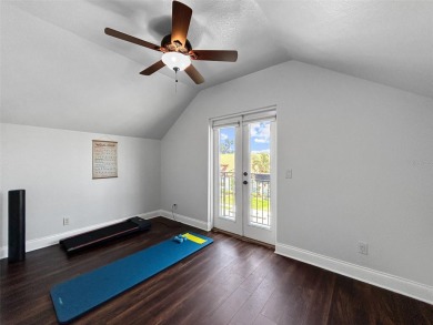 Lovely Meditterrean home welcomes you through rustic double on The Club at Eaglebrooke in Florida - for sale on GolfHomes.com, golf home, golf lot