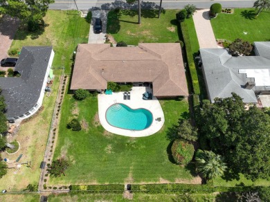 Amazing Neighborhood! Brick 4 Bedroom 2.5 Bath Golf Course Home on Shalimar Pointe Golf and Country Club in Florida - for sale on GolfHomes.com, golf home, golf lot