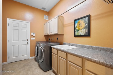 Perched atop a scenic hill in the prestigious Oro Valley Heights on Oro Valley Country Club in Arizona - for sale on GolfHomes.com, golf home, golf lot