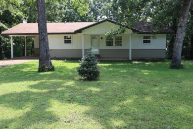 Welcome to 606 Dove Ln, a delightful traditional-style home on The Course At Turkey Mountain in Arkansas - for sale on GolfHomes.com, golf home, golf lot
