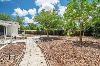 Welcome to this stunning 3-bedroom, 2-bathroom home with over 2 on The Grand Club - Pine Lakes Course in Florida - for sale on GolfHomes.com, golf home, golf lot