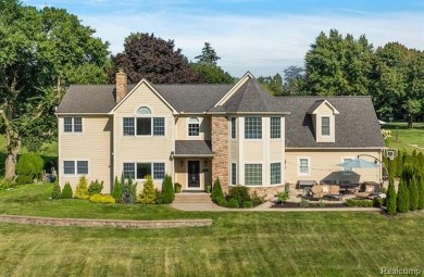 Experience luxury living in this beautifully renovated colonial on Forest Lake Country Club in Michigan - for sale on GolfHomes.com, golf home, golf lot