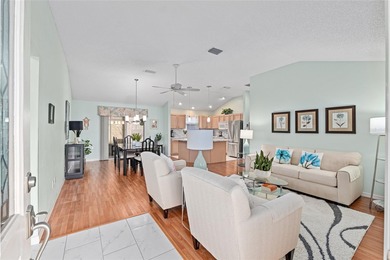 Nestled on a desirable corner homesite shaded by majestic live on Hacienda Hills Golf and Country Club in Florida - for sale on GolfHomes.com, golf home, golf lot