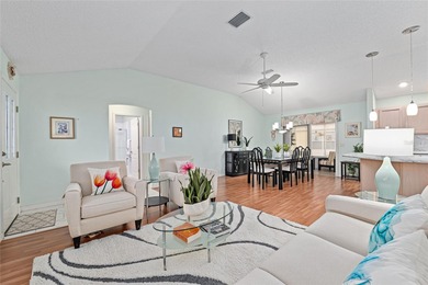 Nestled on a desirable corner homesite shaded by majestic live on Hacienda Hills Golf and Country Club in Florida - for sale on GolfHomes.com, golf home, golf lot