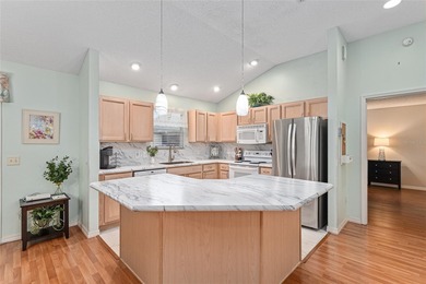 Nestled on a desirable corner homesite shaded by majestic live on Hacienda Hills Golf and Country Club in Florida - for sale on GolfHomes.com, golf home, golf lot