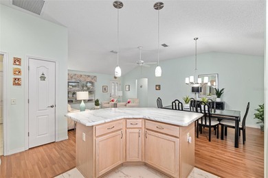 Nestled on a desirable corner homesite shaded by majestic live on Hacienda Hills Golf and Country Club in Florida - for sale on GolfHomes.com, golf home, golf lot