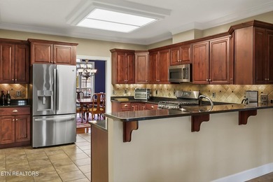 Handsome all-brick, golf course lot, single-level living plus a on Green Meadow Country Club in Tennessee - for sale on GolfHomes.com, golf home, golf lot