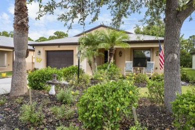 Beautiful CBC home backing to canal.  Magnificent landscaping on Spanish Lakes I in Florida - for sale on GolfHomes.com, golf home, golf lot
