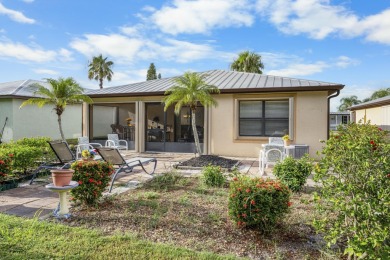 Beautiful CBC home backing to canal.  Magnificent landscaping on Spanish Lakes I in Florida - for sale on GolfHomes.com, golf home, golf lot