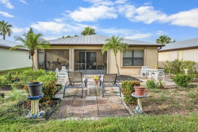 Beautiful CBC home backing to canal.  Magnificent landscaping on Spanish Lakes I in Florida - for sale on GolfHomes.com, golf home, golf lot