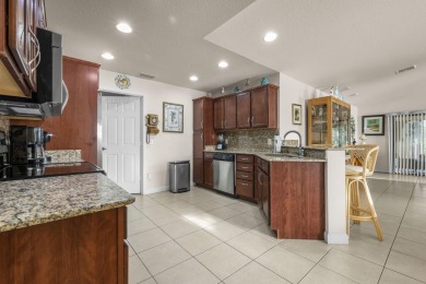 Beautiful CBC home backing to canal.  Magnificent landscaping on Spanish Lakes I in Florida - for sale on GolfHomes.com, golf home, golf lot