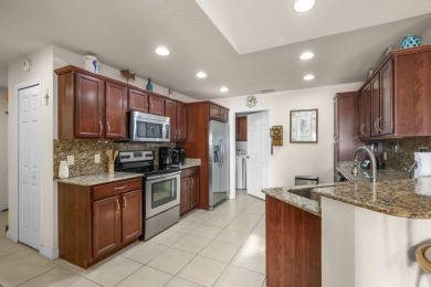 Beautiful CBC home backing to canal.  Magnificent landscaping on Spanish Lakes I in Florida - for sale on GolfHomes.com, golf home, golf lot