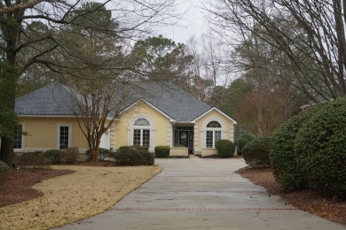 This well maintained home offers a charming courtyard entrance on Woodside Plantation Country Club in South Carolina - for sale on GolfHomes.com, golf home, golf lot