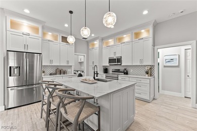 THIS IS LUXURY LIVING IN GATEWAY ! RENOVATED 4 BEDROOM AND 3 on Gateway Golf and Country Club in Florida - for sale on GolfHomes.com, golf home, golf lot