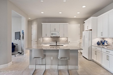 Newly designed Arbor III townhome with a desirable side entrance on Plantation Bay Golf and Country Club in Florida - for sale on GolfHomes.com, golf home, golf lot