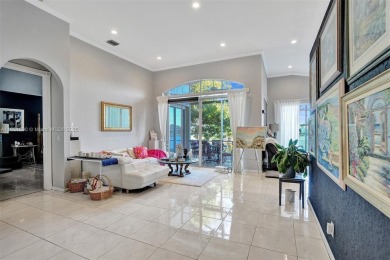 This spacious 1-story home offers serene water views from nearly on Woodmont Country Club in Florida - for sale on GolfHomes.com, golf home, golf lot