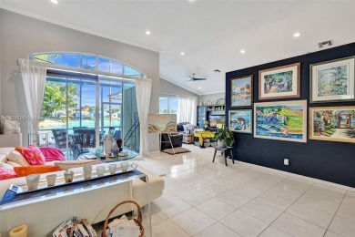 This spacious 1-story home offers serene water views from nearly on Woodmont Country Club in Florida - for sale on GolfHomes.com, golf home, golf lot