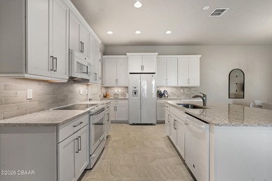 Newly designed Arbor III townhome with a desirable side entrance on Plantation Bay Golf and Country Club in Florida - for sale on GolfHomes.com, golf home, golf lot