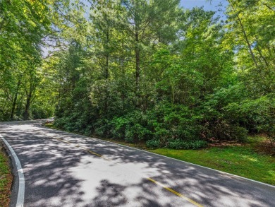 Nestled between holes 11 and 12 of Lake Toxaway Country Club's on Lake Toxaway Country Club in North Carolina - for sale on GolfHomes.com, golf home, golf lot