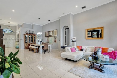 This spacious 1-story home offers serene water views from nearly on Woodmont Country Club in Florida - for sale on GolfHomes.com, golf home, golf lot