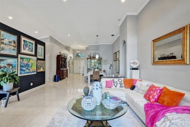 This spacious 1-story home offers serene water views from nearly on Woodmont Country Club in Florida - for sale on GolfHomes.com, golf home, golf lot