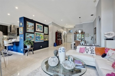 This spacious 1-story home offers serene water views from nearly on Woodmont Country Club in Florida - for sale on GolfHomes.com, golf home, golf lot