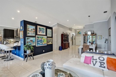 This spacious 1-story home offers serene water views from nearly on Woodmont Country Club in Florida - for sale on GolfHomes.com, golf home, golf lot