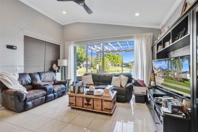 This spacious 1-story home offers serene water views from nearly on Woodmont Country Club in Florida - for sale on GolfHomes.com, golf home, golf lot