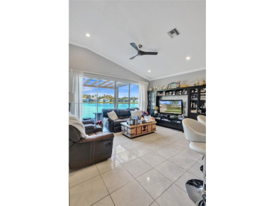 This spacious 1-story home offers serene water views from nearly on Woodmont Country Club in Florida - for sale on GolfHomes.com, golf home, golf lot