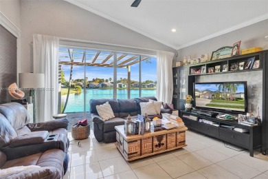 This spacious 1-story home offers serene water views from nearly on Woodmont Country Club in Florida - for sale on GolfHomes.com, golf home, golf lot