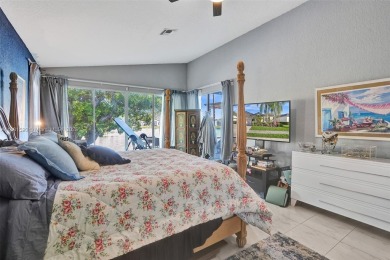 This spacious 1-story home offers serene water views from nearly on Woodmont Country Club in Florida - for sale on GolfHomes.com, golf home, golf lot