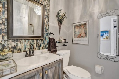 This spacious 1-story home offers serene water views from nearly on Woodmont Country Club in Florida - for sale on GolfHomes.com, golf home, golf lot