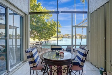 This spacious 1-story home offers serene water views from nearly on Woodmont Country Club in Florida - for sale on GolfHomes.com, golf home, golf lot