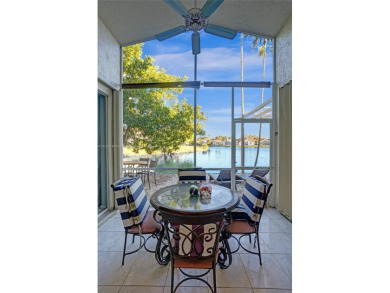 This spacious 1-story home offers serene water views from nearly on Woodmont Country Club in Florida - for sale on GolfHomes.com, golf home, golf lot